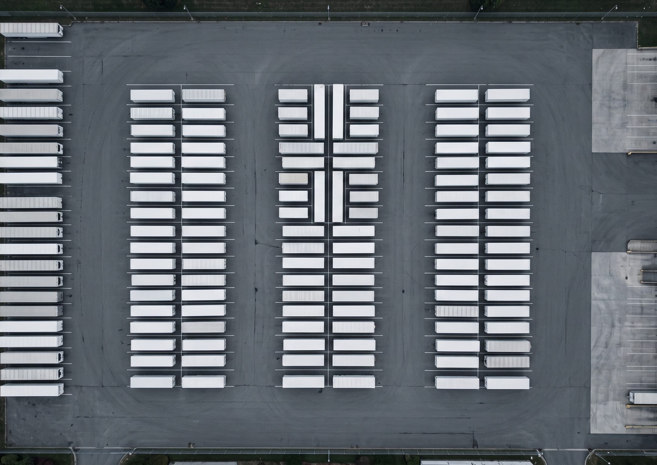 Aerial view of a depot yard, trailers parked in rows